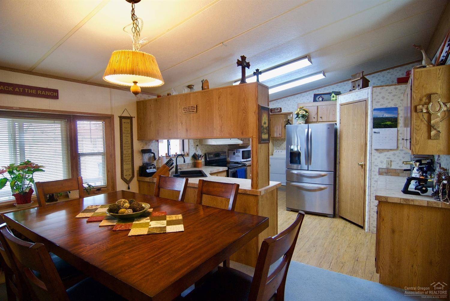 6006 Southwest Cougar Road Terrebonne, OR 97760 - Photo 10 of 20 family sized dining room area that opens