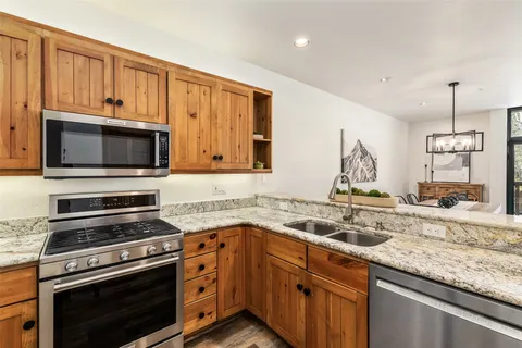 a kitchen with a stove and a microwave