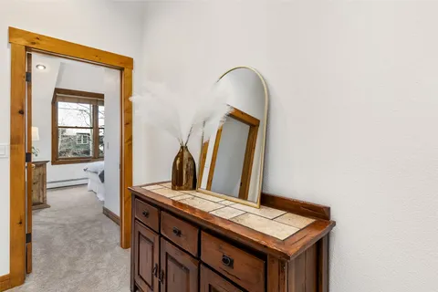 a bathroom with a sink a mirror and a vanity