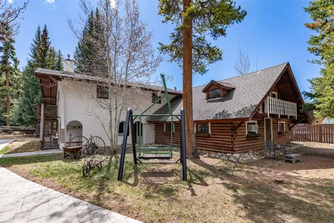 a picture of a bench in front of a house