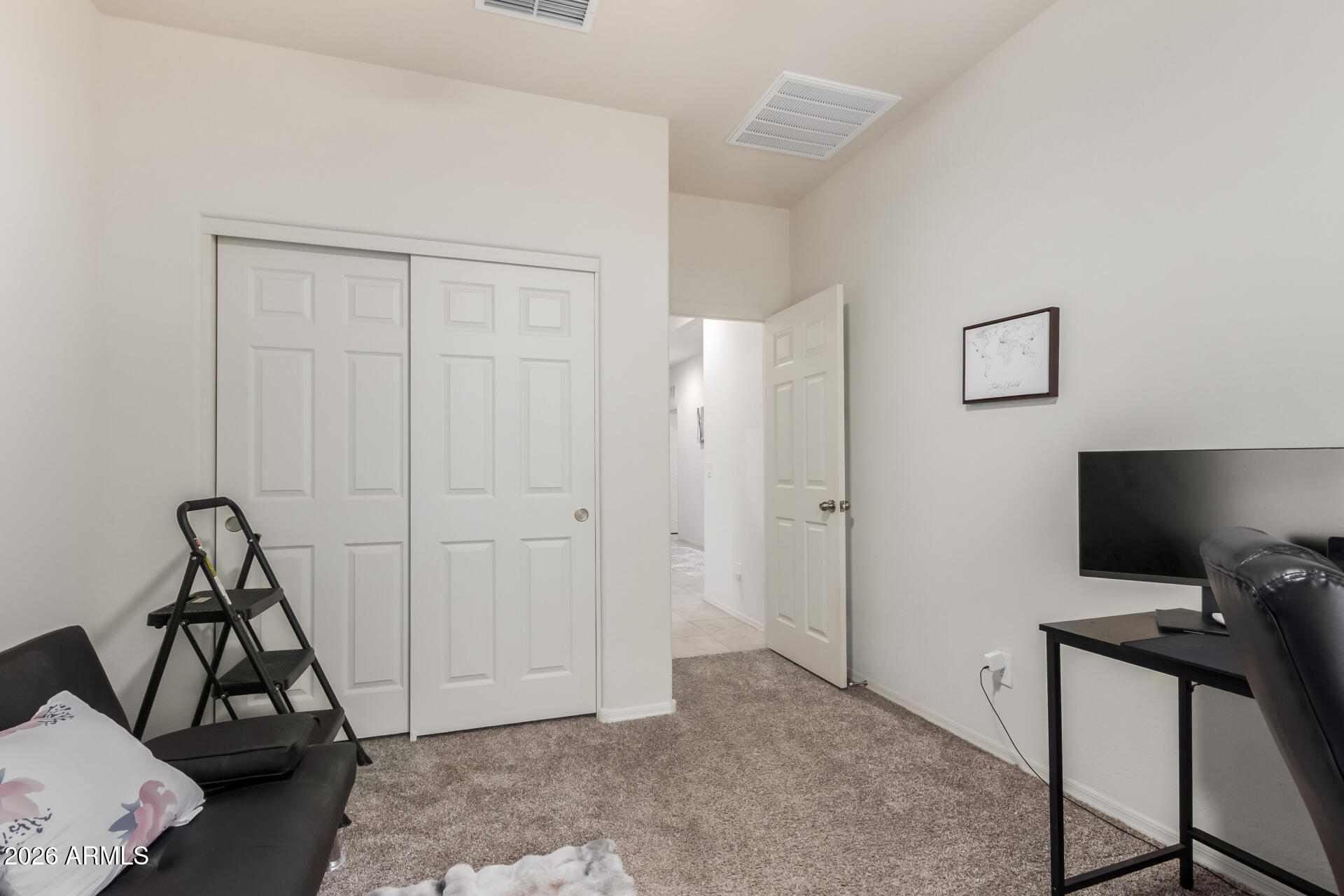 11214 West Bloch Road Tolleson, AZ 85353 - Photo 19 of 24 a view of a livingroom with furniture and a window