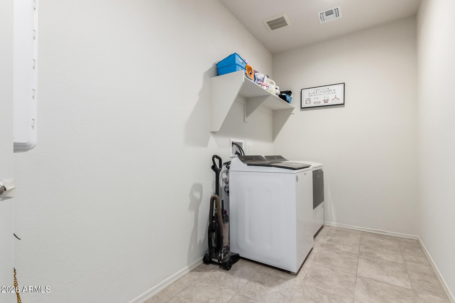 11214 West Bloch Road Tolleson, AZ 85353 - Photo 22 of 24 a utility room with dryer and washer