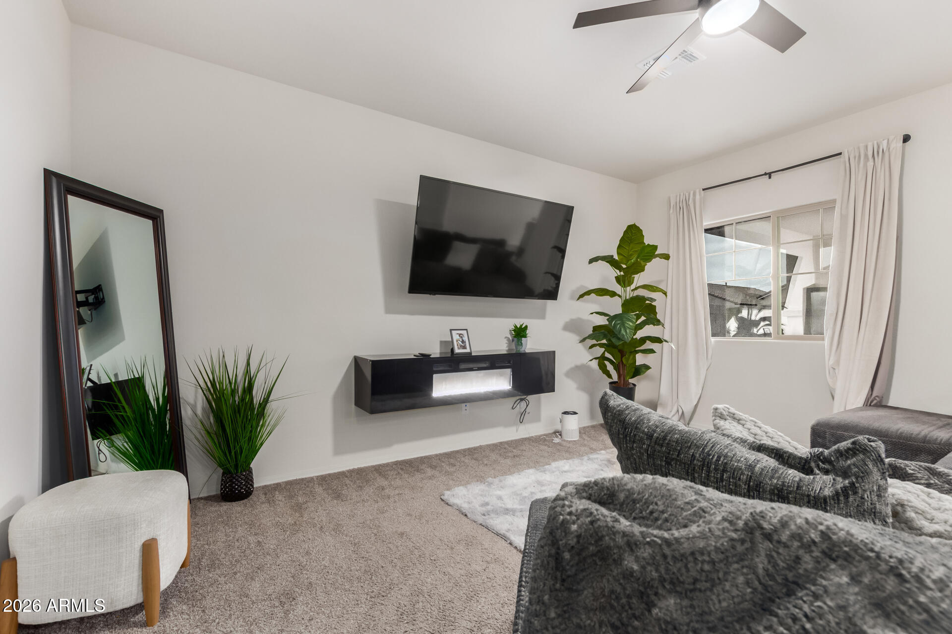 11214 West Bloch Road Tolleson, AZ 85353 - Photo 8 of 24 a living room with furniture and a flat screen tv