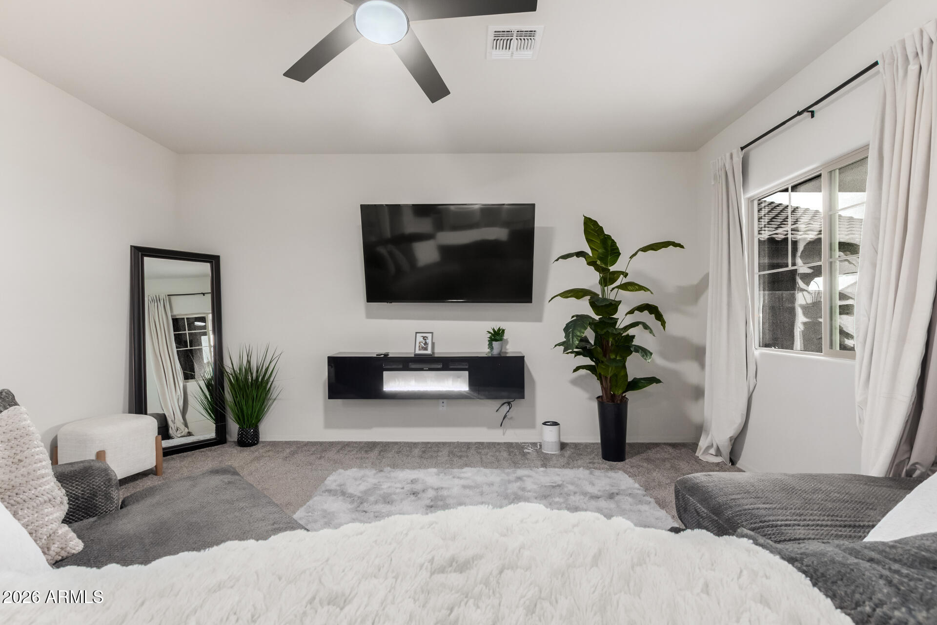 11214 West Bloch Road Tolleson, AZ 85353 - Photo 10 of 24 a living room with furniture and a flat screen tv