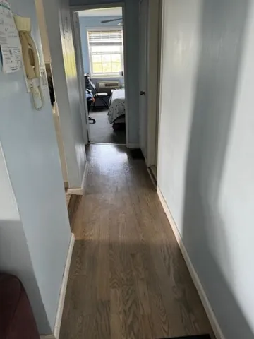 a view of a hallway with a livingroom