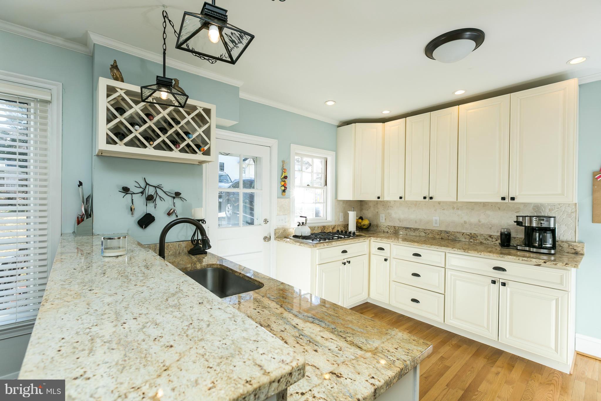 611 Wilton Road Towson, MD 21286 - Photo 2 of 30 a kitchen with sink cabinets and window