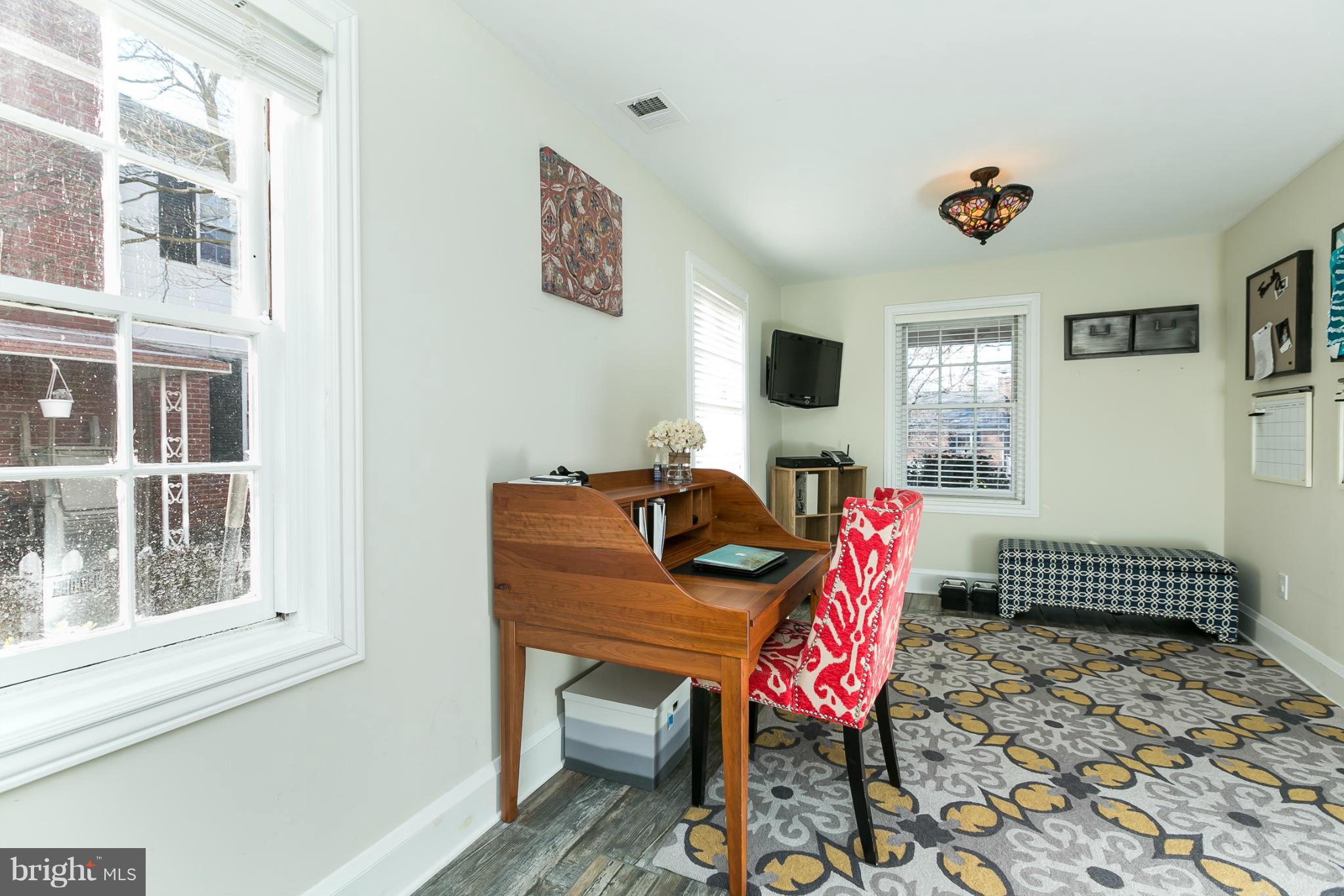 611 Wilton Road Towson, MD 21286 - Photo 12 of 30 a living room with furniture a rug and a window