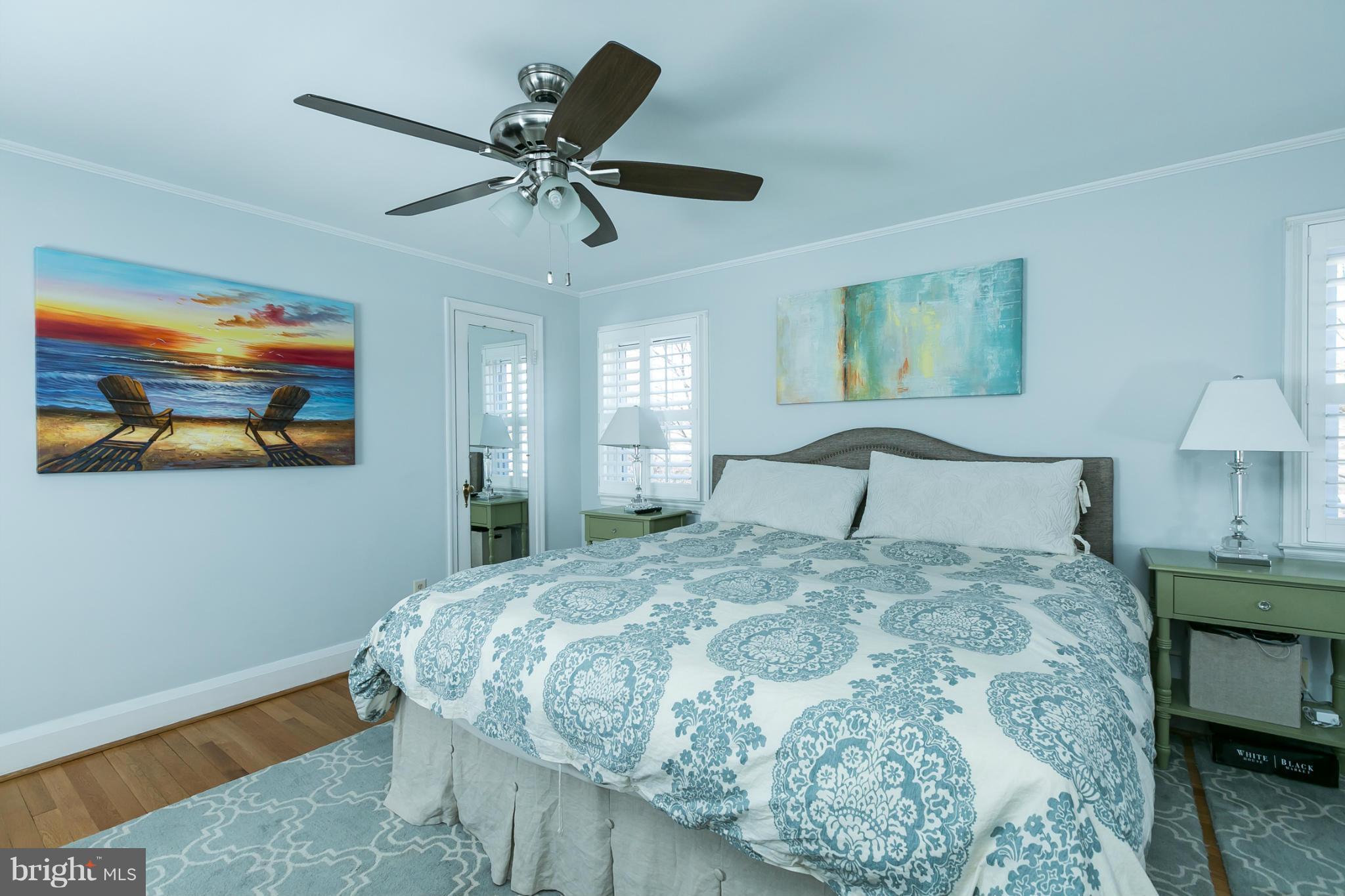 611 Wilton Road Towson, MD 21286 - Photo 17 of 30 a bedroom with a bed and a chandelier