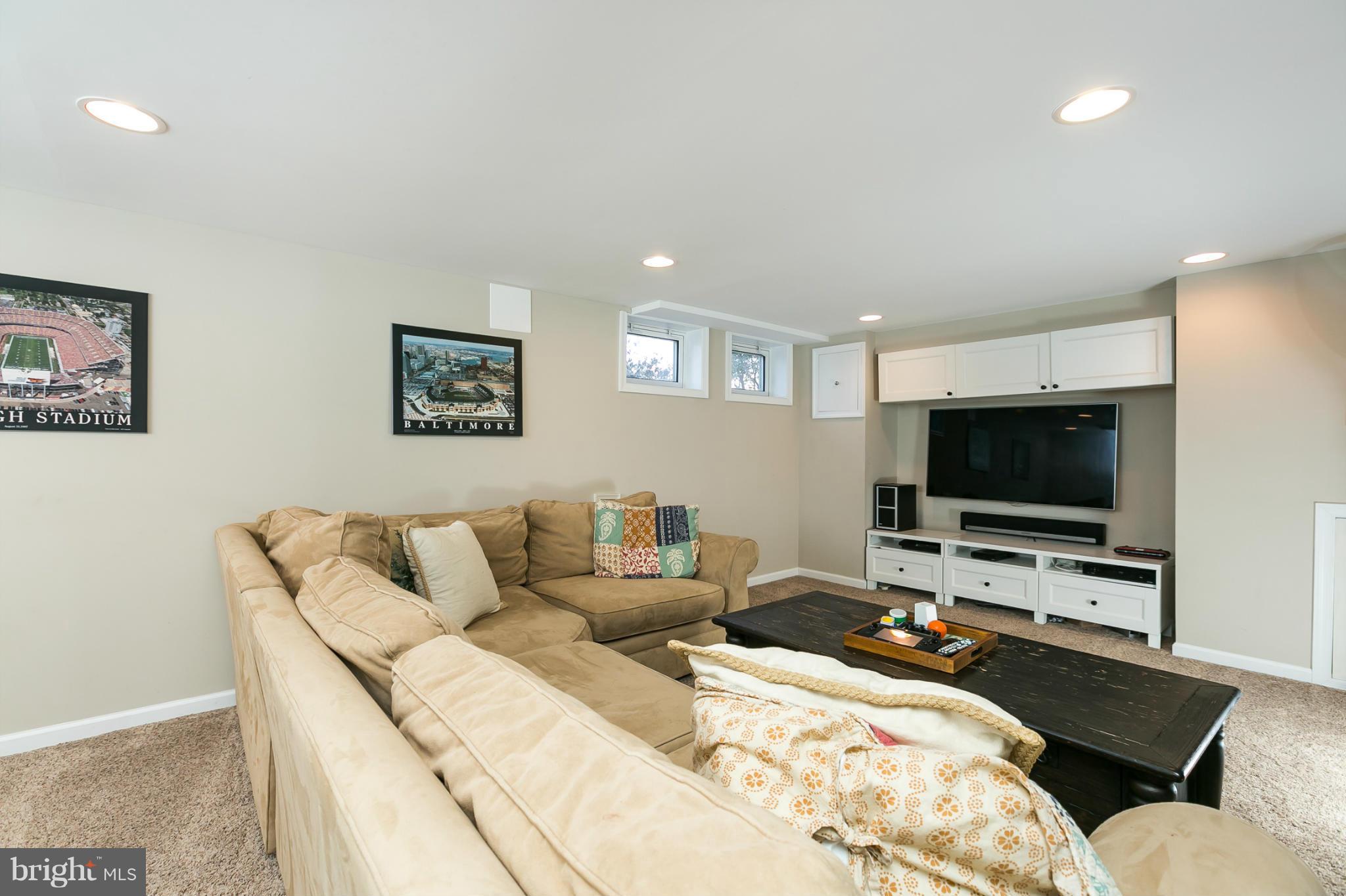 611 Wilton Road Towson, MD 21286 - Photo 25 of 30 a living room with furniture and a flat screen tv