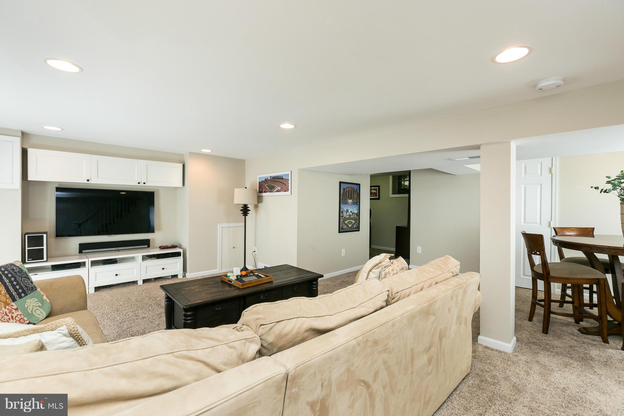 611 Wilton Road Towson, MD 21286 - Photo 26 of 30 a living room with furniture and a flat screen tv