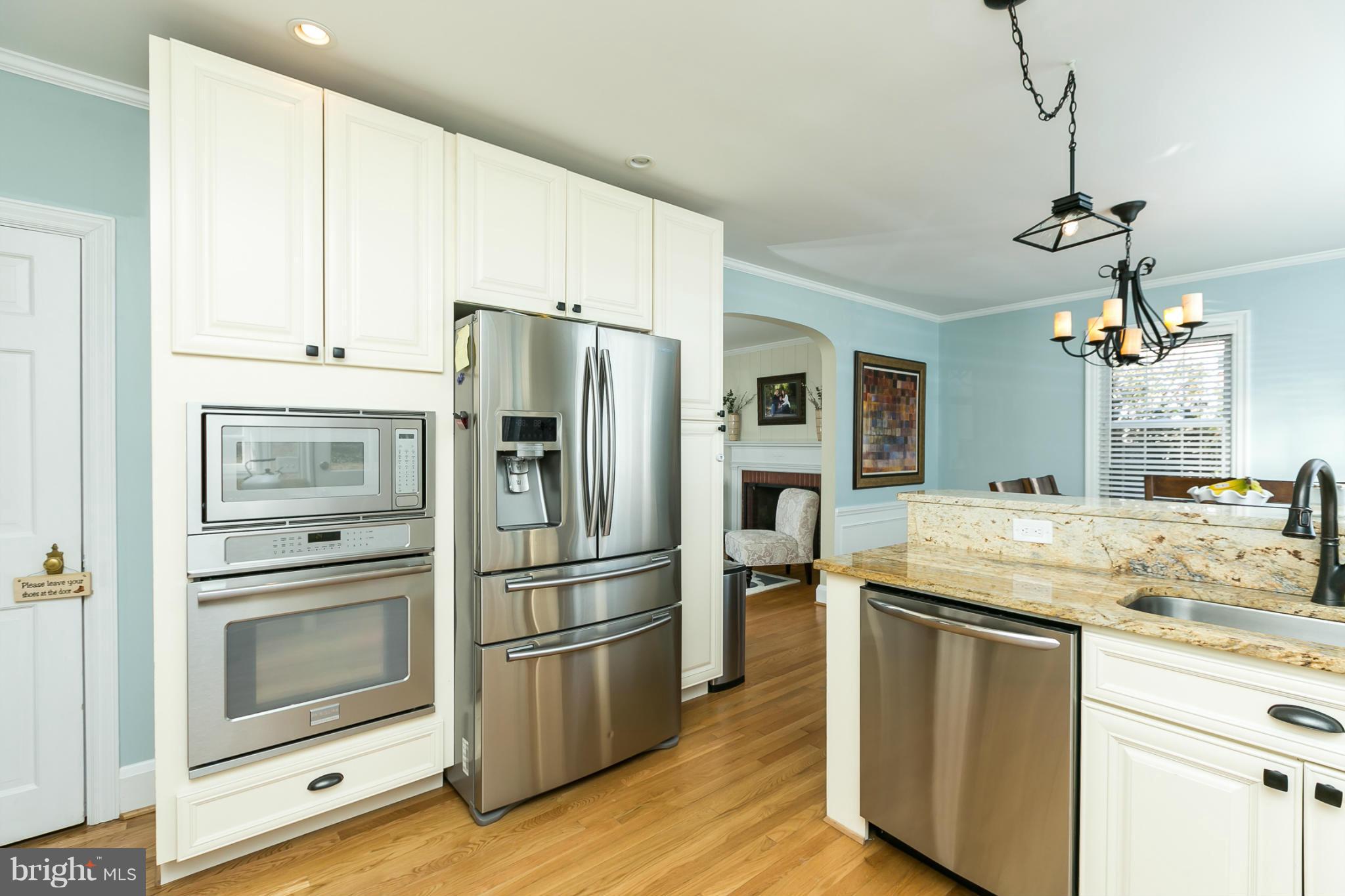 611 Wilton Road Towson, MD 21286 - Photo 4 of 30 a kitchen with granite countertop a refrigerator oven a sink and dishwasher