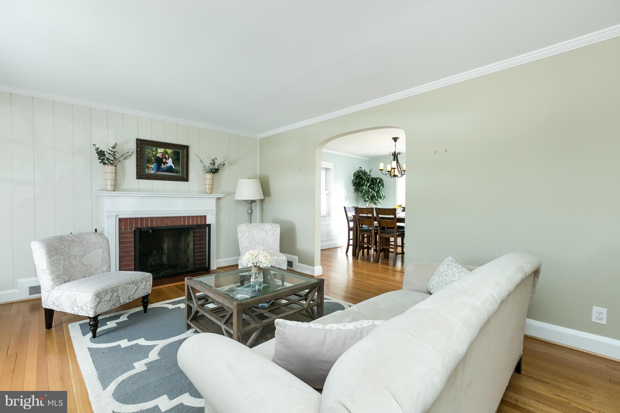 611 Wilton Road Towson, MD 21286 - Photo 7 of 30 a living room with furniture and a fireplace
