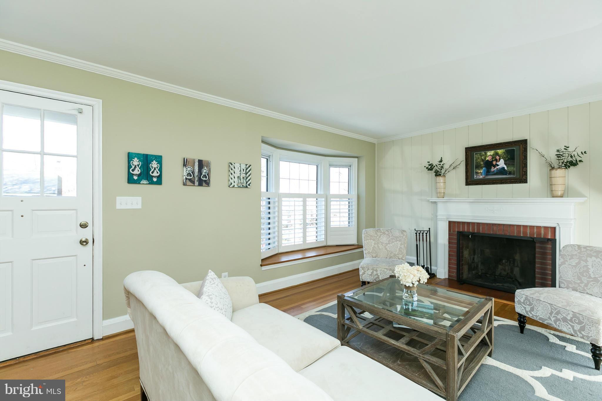 611 Wilton Road Towson, MD 21286 - Photo 9 of 30 a living room with furniture and a fireplace