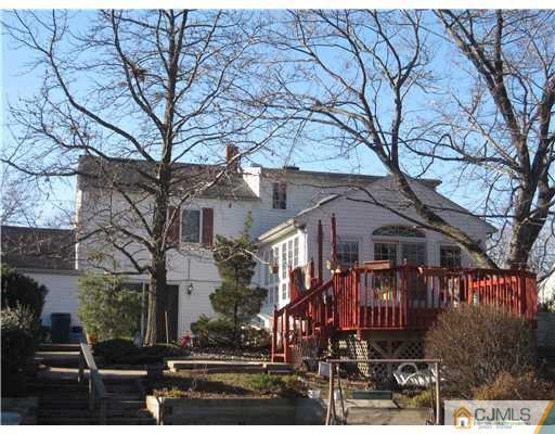 23 Phillips Road Edison, NJ 08817 - Photo 2 of 12 a front view of a house with a tree