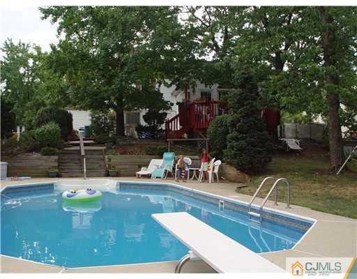 23 Phillips Road Edison, NJ 08817 - Photo 3 of 12 a view of a swimming pool with a patio