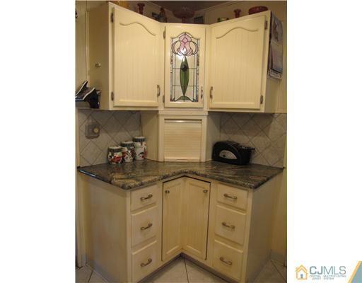 23 Phillips Road Edison, NJ 08817 - Photo 6 of 12 a kitchen with stainless steel appliances granite countertop a sink and cabinets