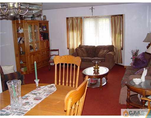 23 Phillips Road Edison, NJ 08817 - Photo 7 of 12 a view of a livingroom with furniture and window