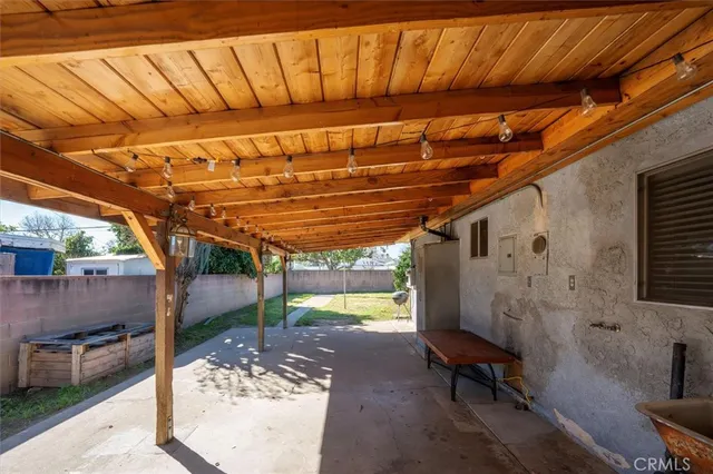 a view of a backyard with table and chairs