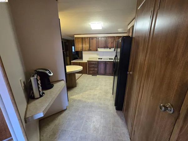 a view of a hallway with storage and utility