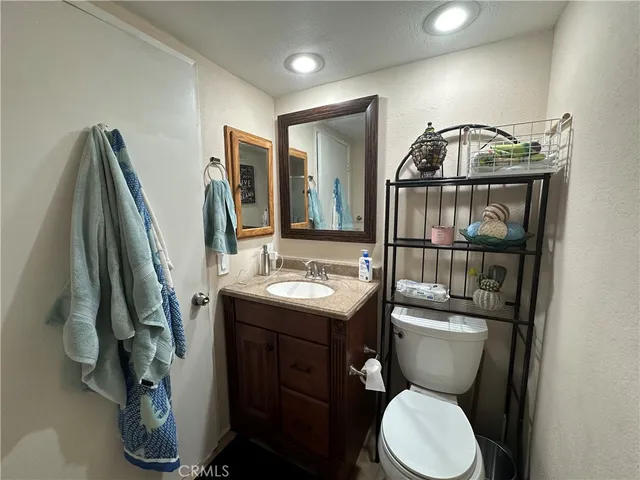 a bedroom with a bed and lamp with furniture