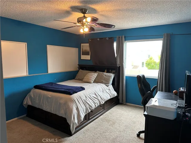 a view of a room with furniture and wooden floor