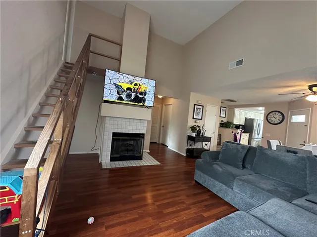 a view of a livingroom with furniture and a window