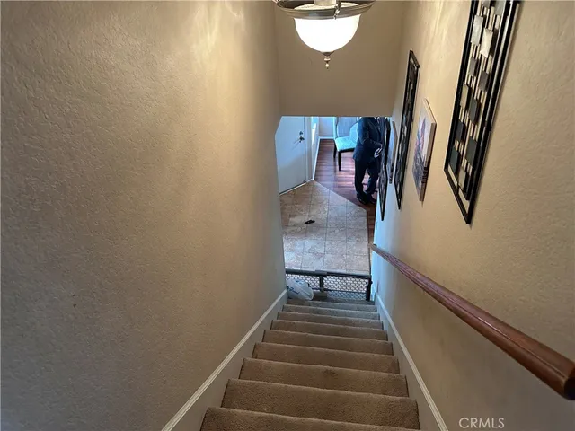 a view of a hallway with furniture and front door