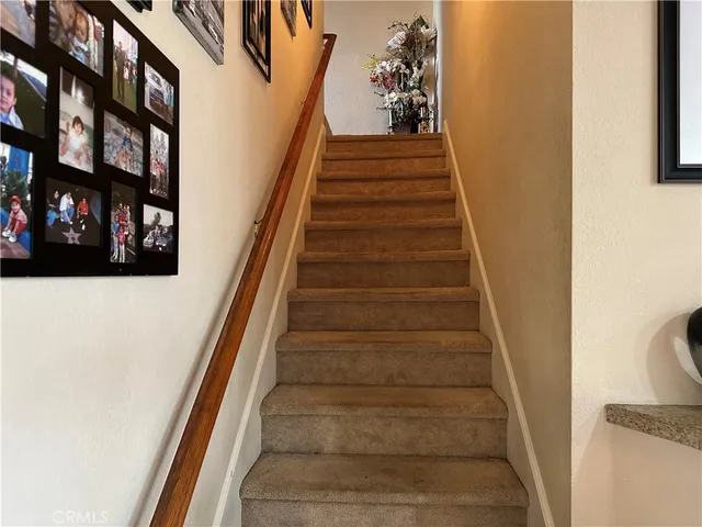 a kitchen with stainless steel appliances a stove a sink and a microwave