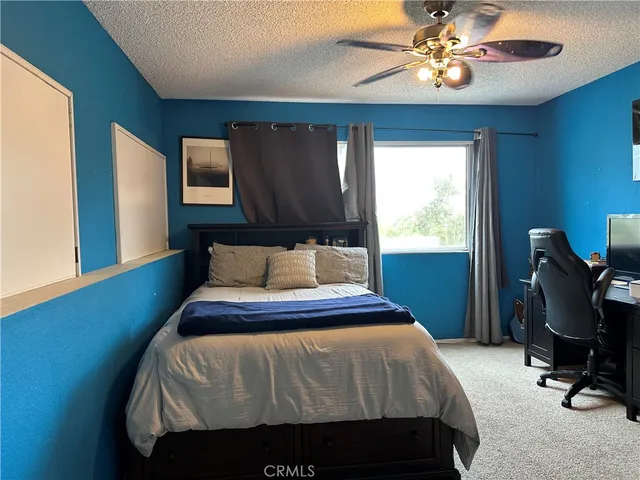 a bathroom with a toilet a sink and a mirror