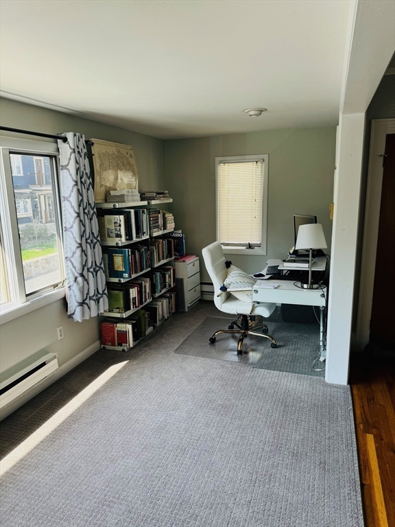 43 Chapman Street, Unit 2 Watertown, MA 02472 - Photo 9 of 12 a reading room with furniture and a book shelf