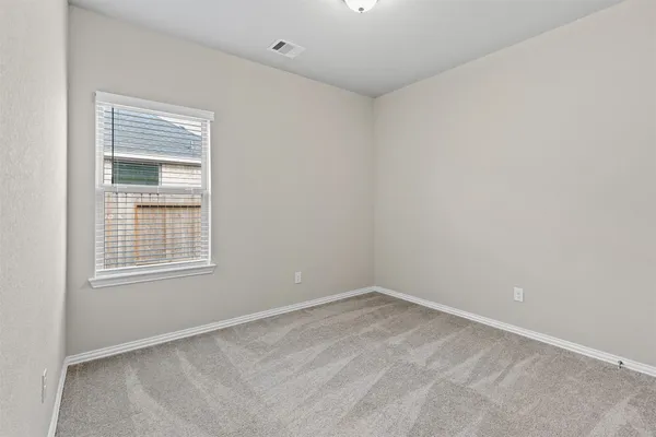 a bathroom with a granite countertop sink a toilet a mirror and bathtub
