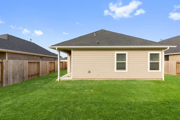 a view of a back yard of the house