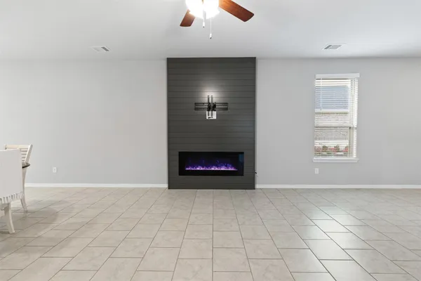 a kitchen with kitchen island granite countertop a sink a center island stainless steel appliances and cabinets