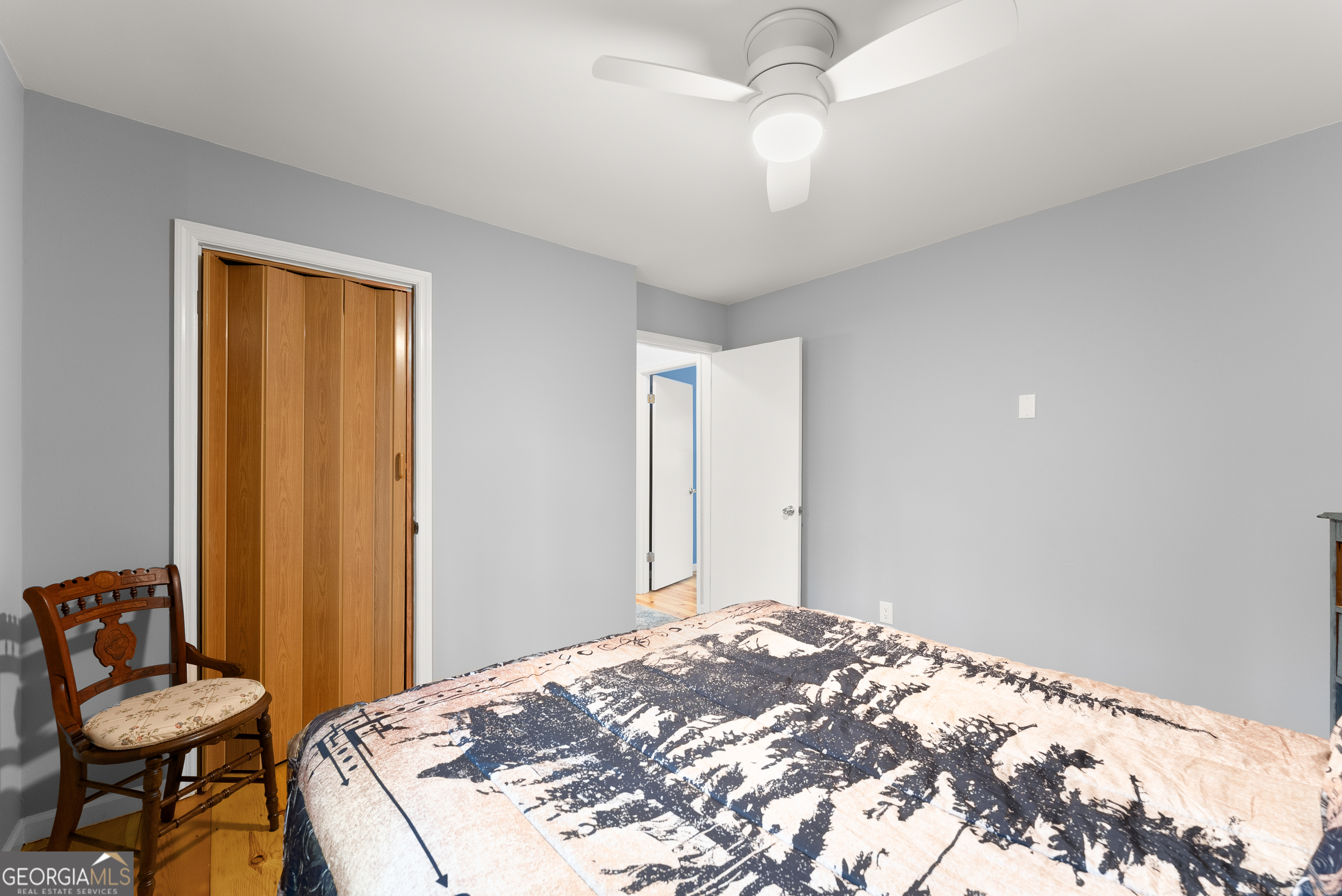 426 Skyview Circle Clarkesville, GA 30523 - Photo 16 of 42 a bedroom with a bed and a chair