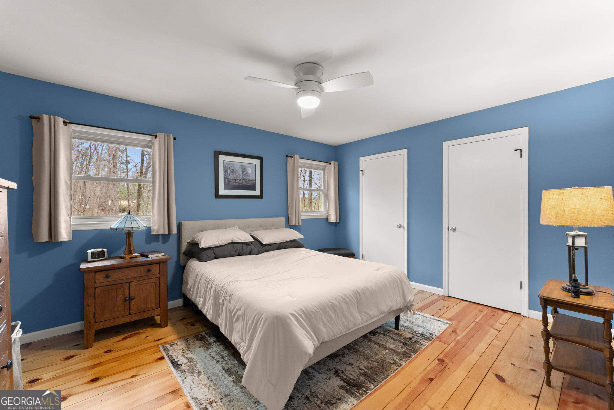 426 Skyview Circle Clarkesville, GA 30523 - Photo 18 of 42 a bedroom with a bed and wooden floor