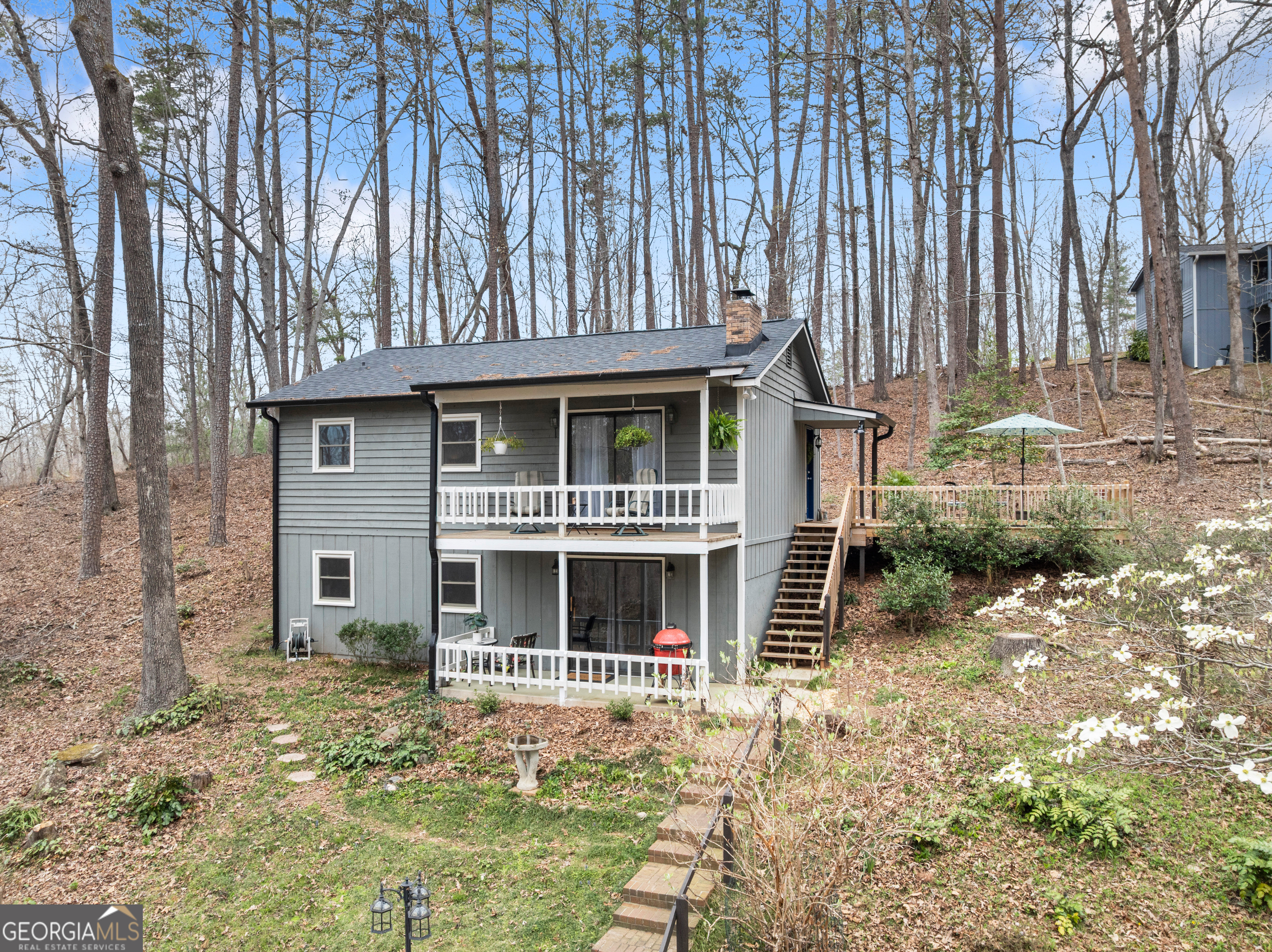 426 Skyview Circle Clarkesville, GA 30523 - Photo 2 of 42 a front view of a house with garden