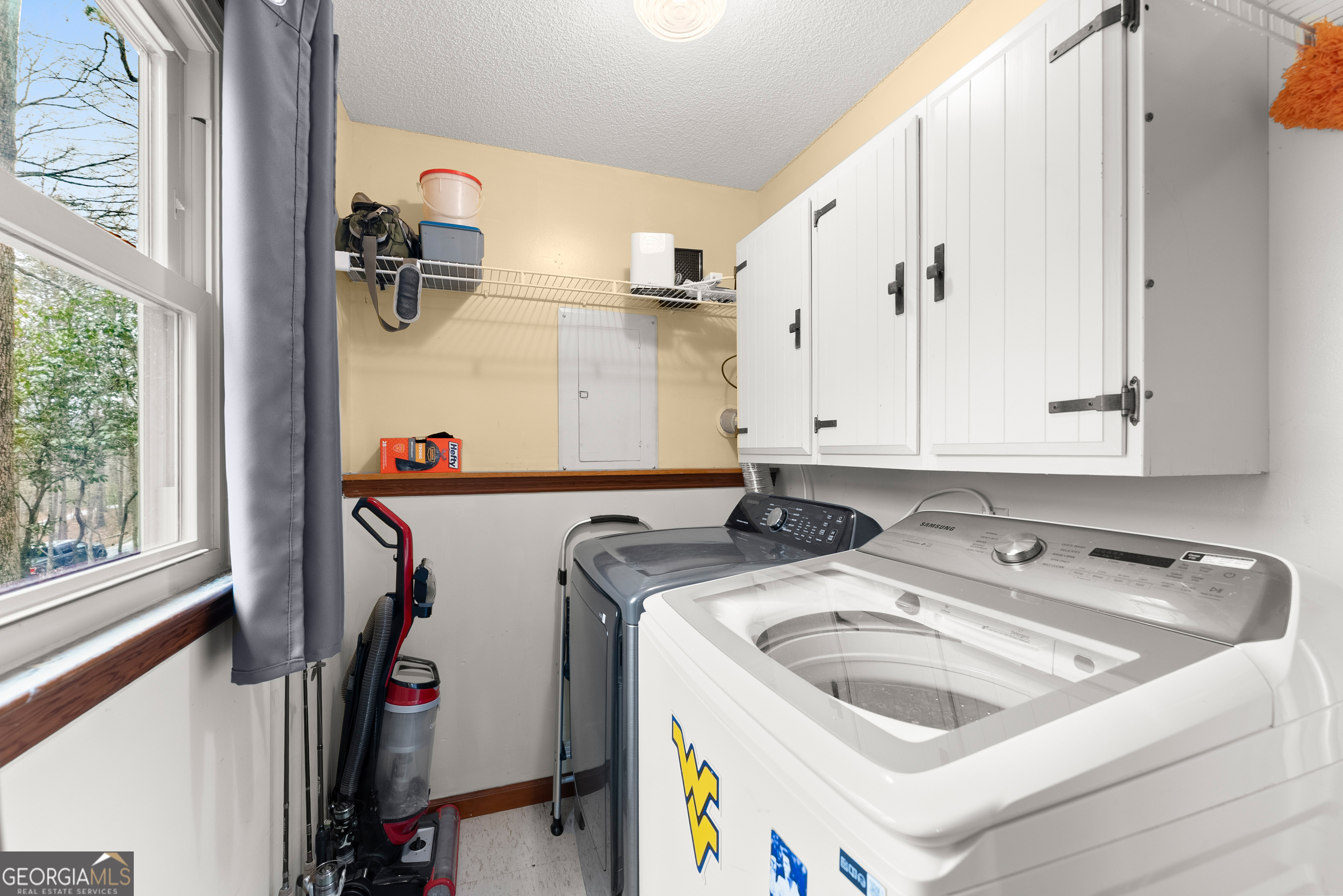 426 Skyview Circle Clarkesville, GA 30523 - Photo 25 of 42 a utility room with dryer and washer