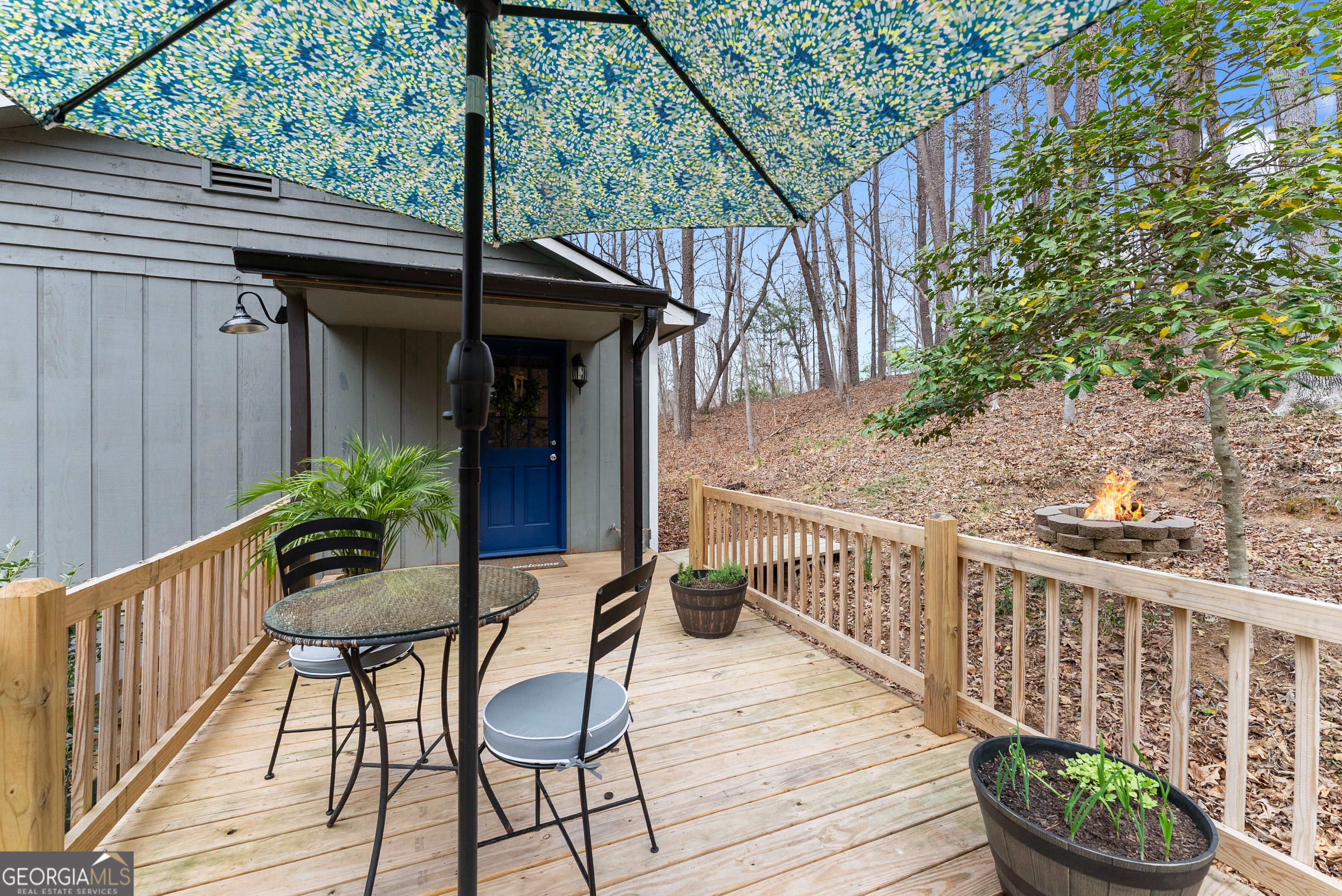 426 Skyview Circle Clarkesville, GA 30523 - Photo 30 of 42 a view of a chair and tables in the balcony