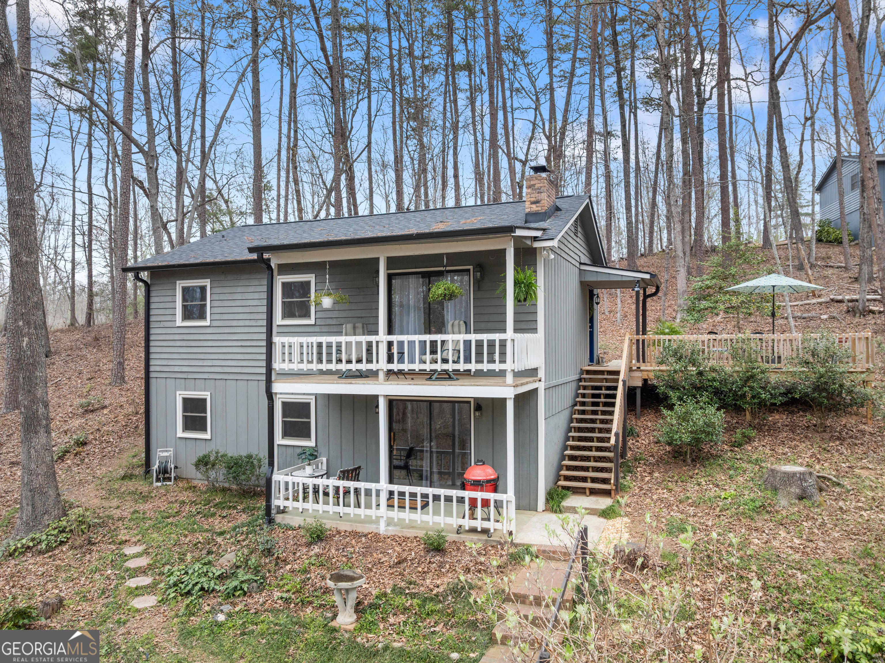 426 Skyview Circle Clarkesville, GA 30523 - Photo 3 of 42 a front view of a house with a garden