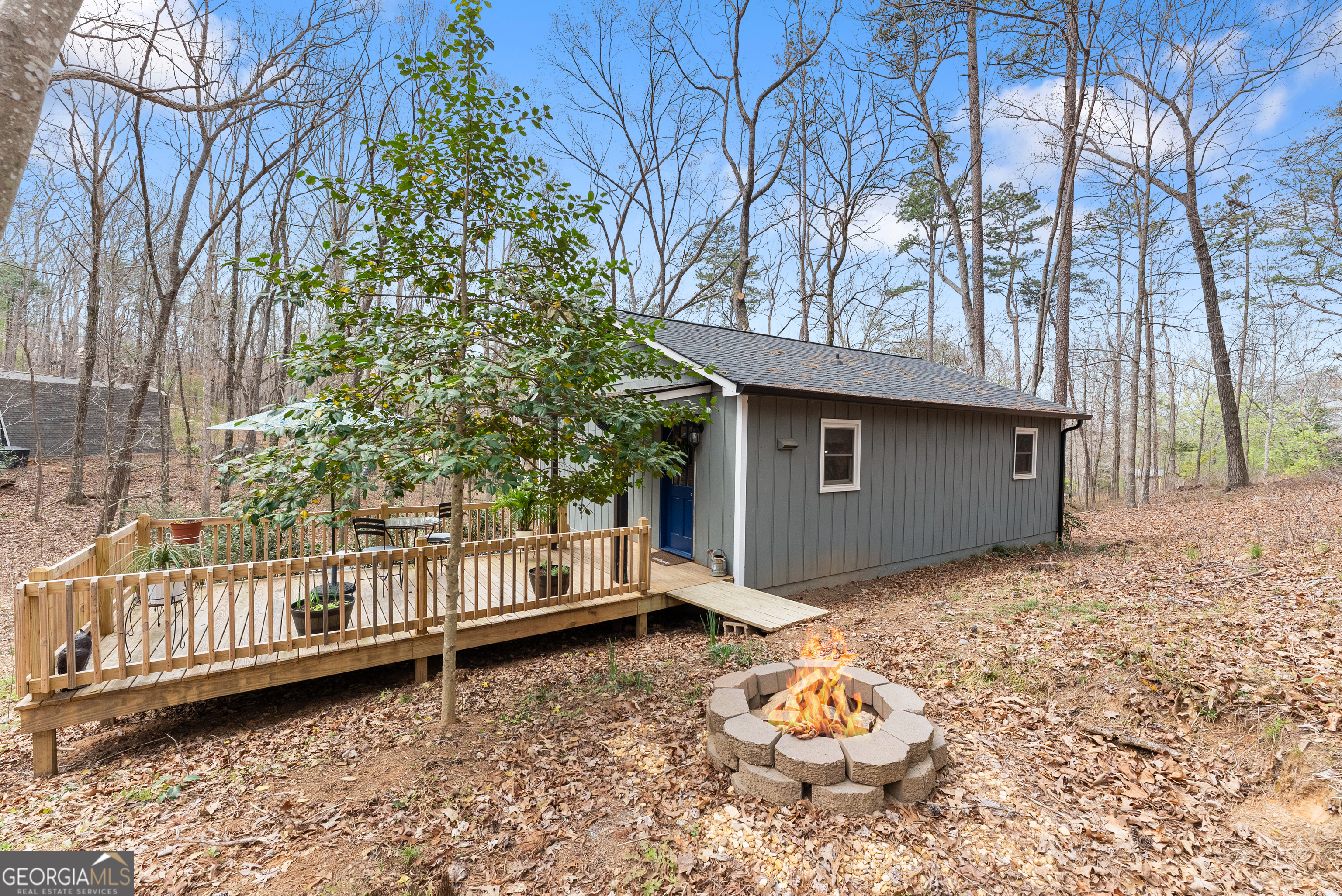 426 Skyview Circle Clarkesville, GA 30523 - Photo 31 of 42 a backyard of a house with a tree