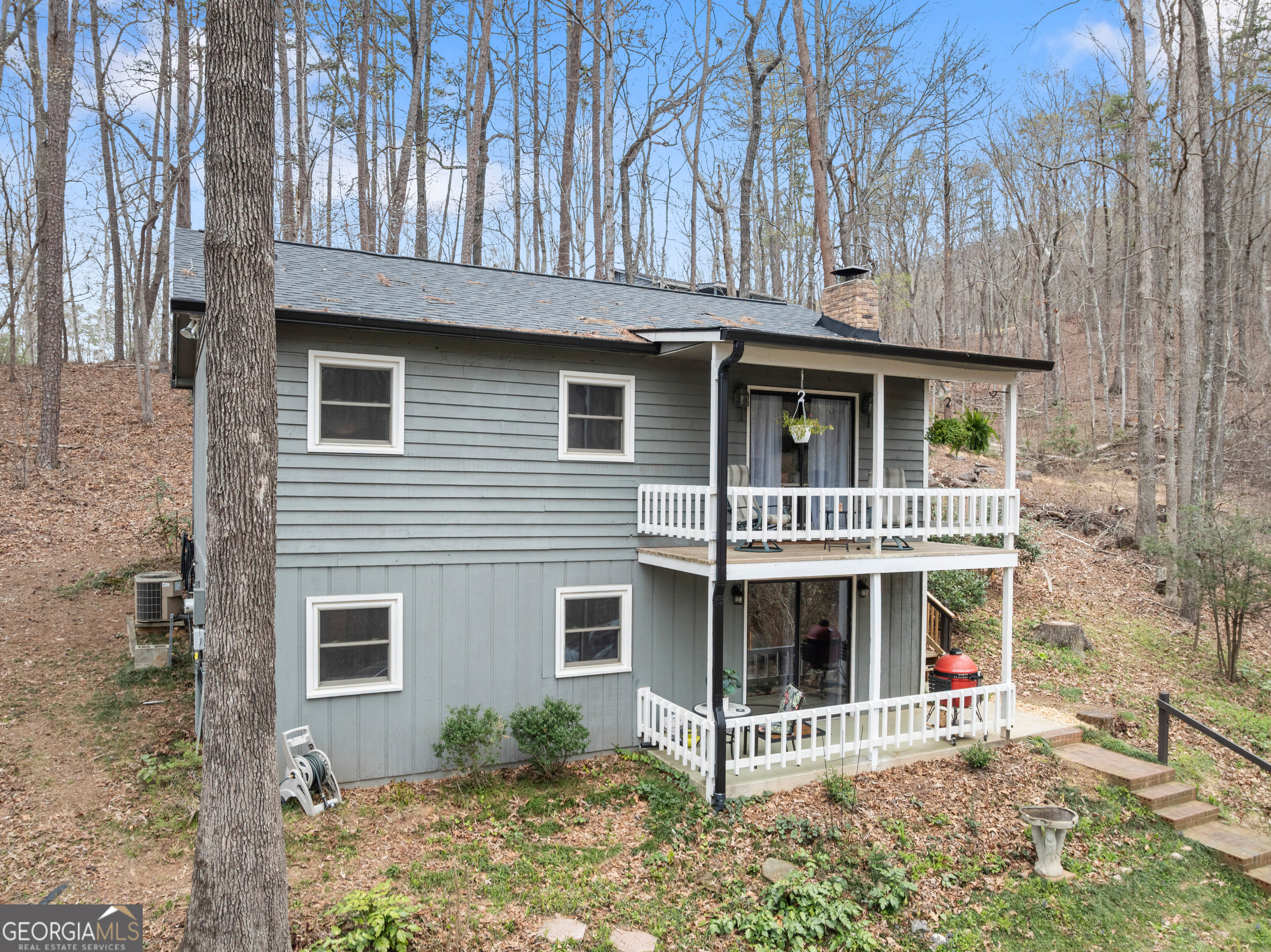 426 Skyview Circle Clarkesville, GA 30523 - Photo 4 of 42 a view of small house with a yard and wooden fence