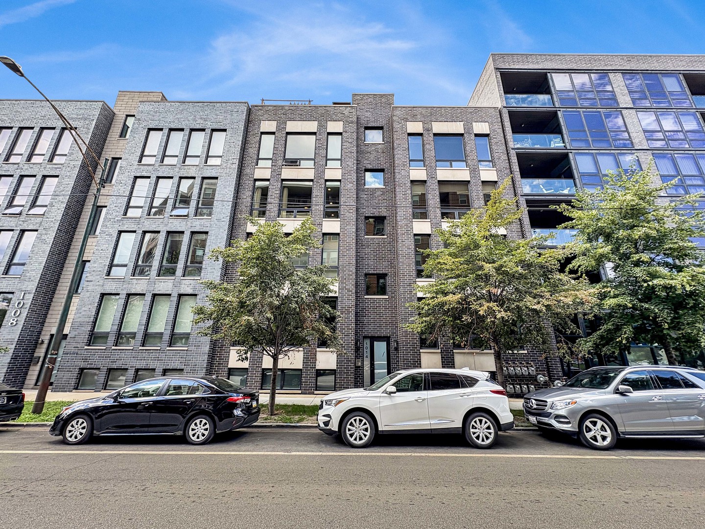 a view of a car parked in front of a building