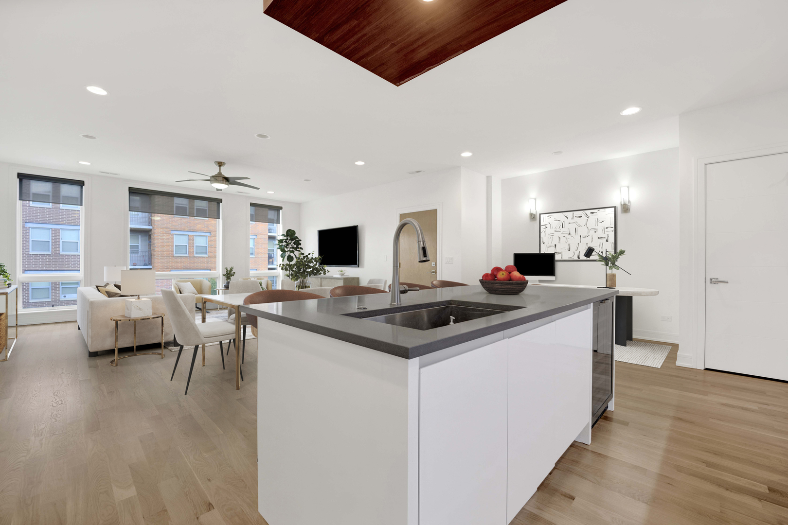 1014 North Larrabee Street, Unit 4N Chicago, IL 60610 - Photo 11 of 24 a kitchen with stainless steel appliances kitchen island hardwood floor sink and stove