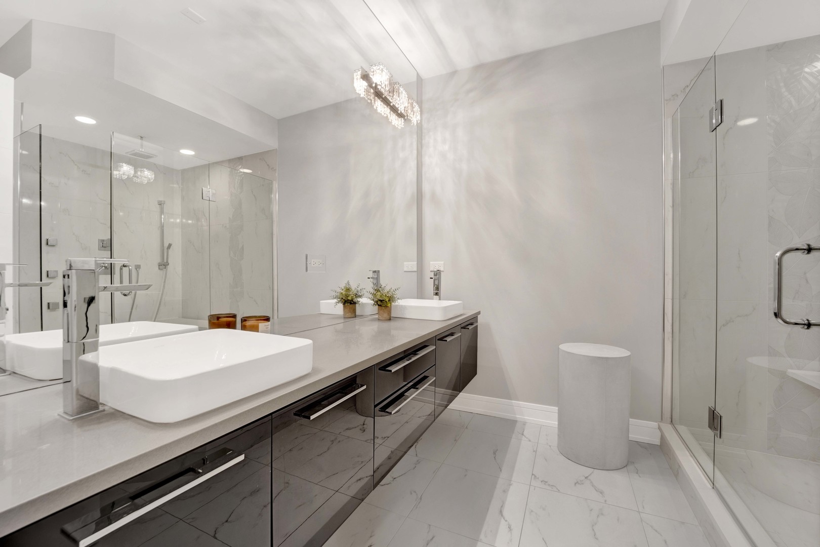 1014 North Larrabee Street, Unit 4N Chicago, IL 60610 - Photo 14 of 24 a bathroom with a double vanity sink and a mirror