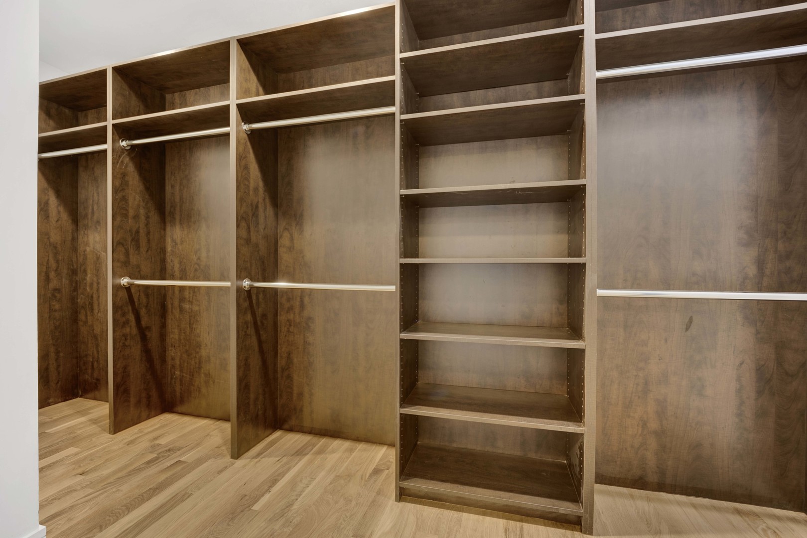 1014 North Larrabee Street, Unit 4N Chicago, IL 60610 - Photo 16 of 24 a view of walk in closet with empty racks