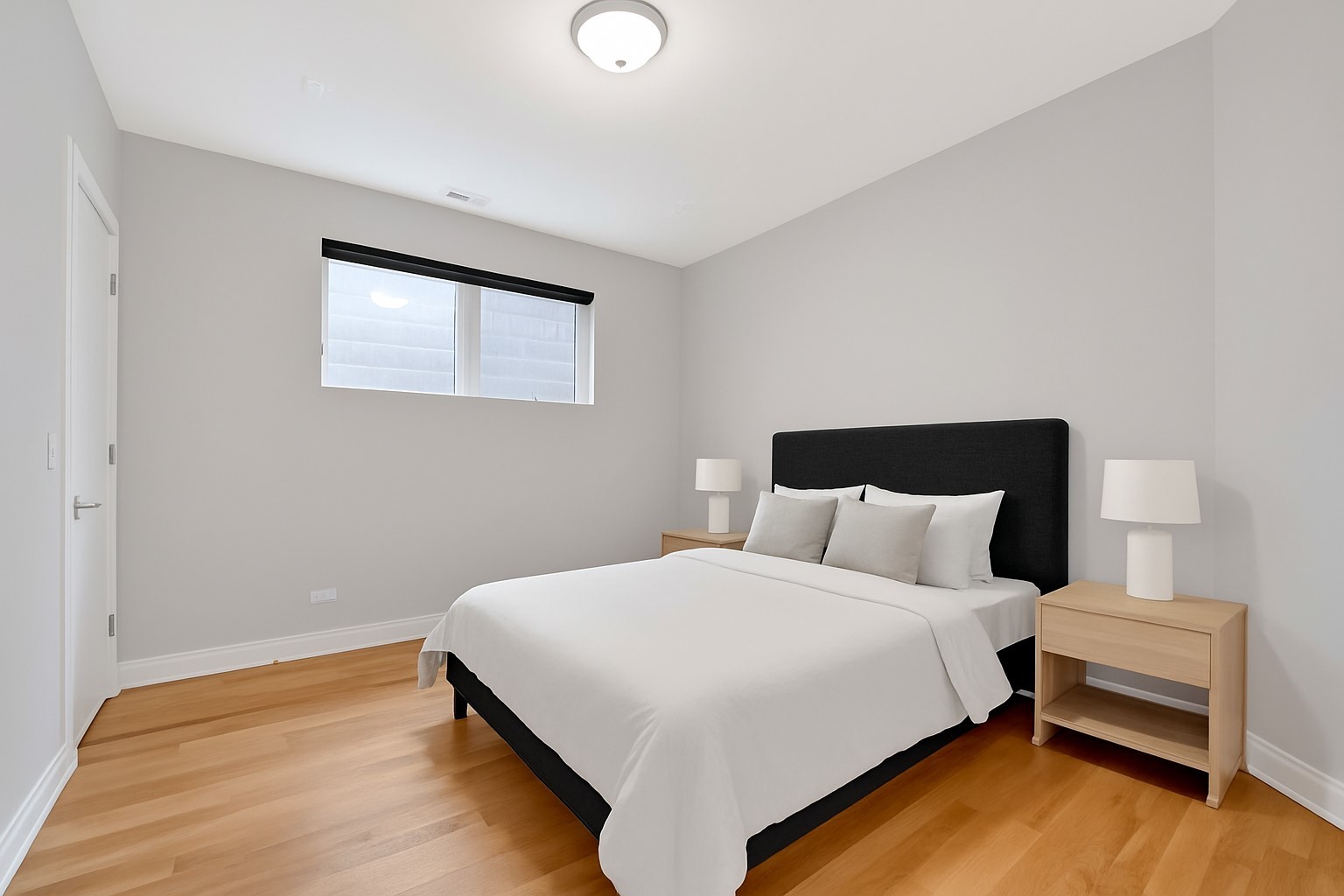 1014 North Larrabee Street, Unit 4N Chicago, IL 60610 - Photo 18 of 24 a bedroom with a bed and a night stand