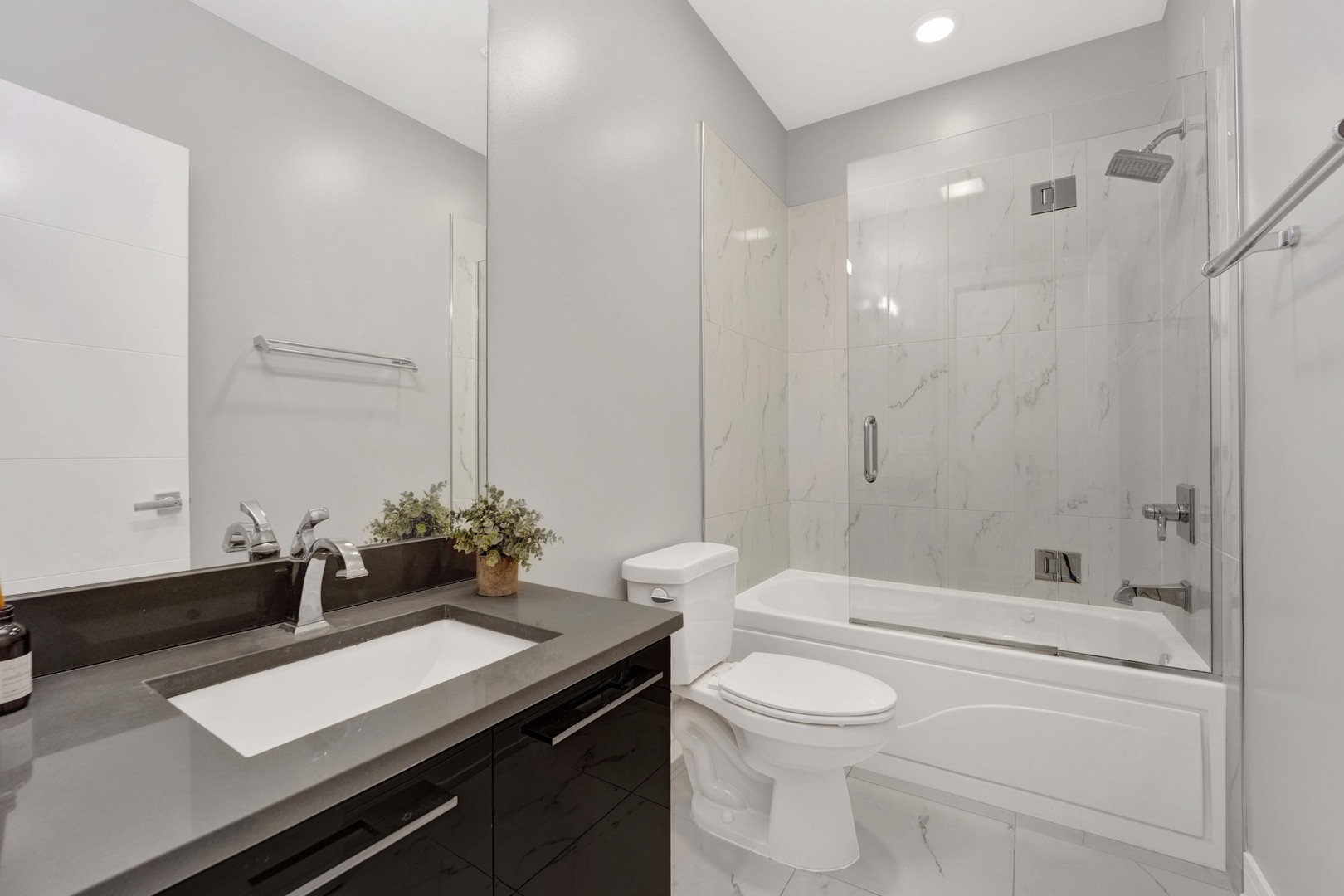 1014 North Larrabee Street, Unit 4N Chicago, IL 60610 - Photo 19 of 24 a bathroom with a sink a toilet and shower