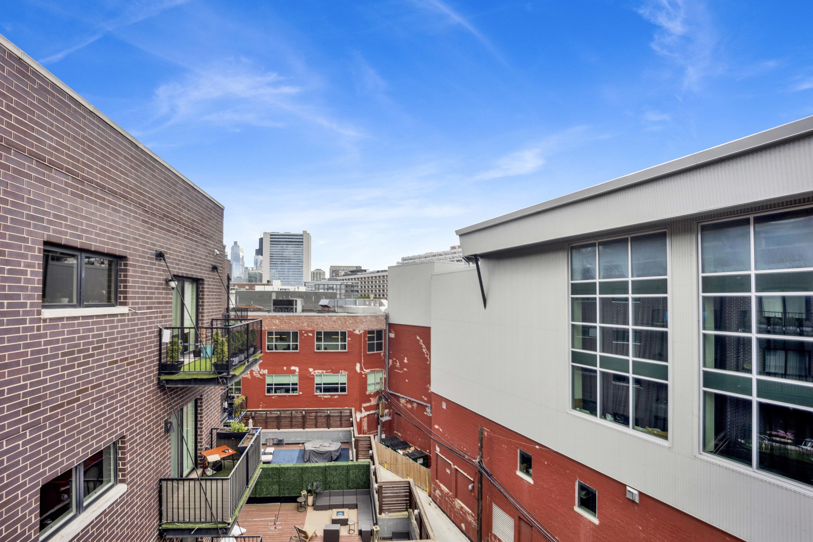 1014 North Larrabee Street, Unit 4N Chicago, IL 60610 - Photo 22 of 24 a front view of a building with large windows
