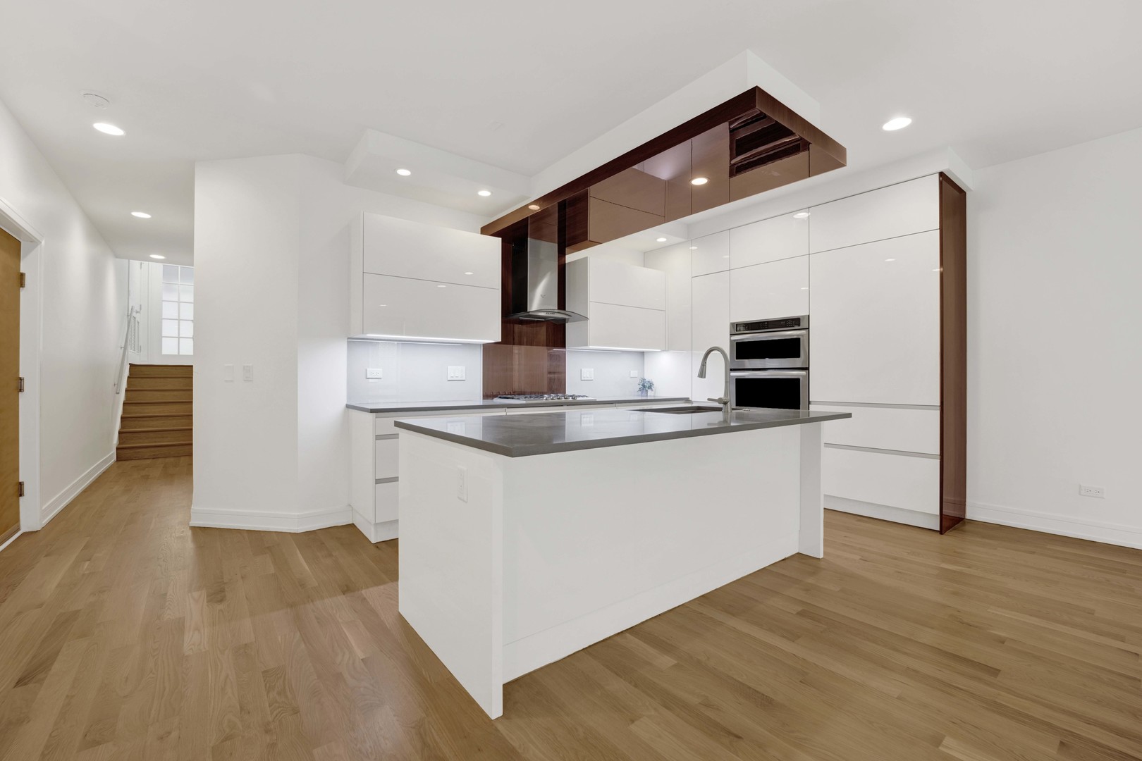 1014 North Larrabee Street, Unit 4N Chicago, IL 60610 - Photo 8 of 24 a kitchen with stainless steel appliances granite countertop a refrigerator and a sink