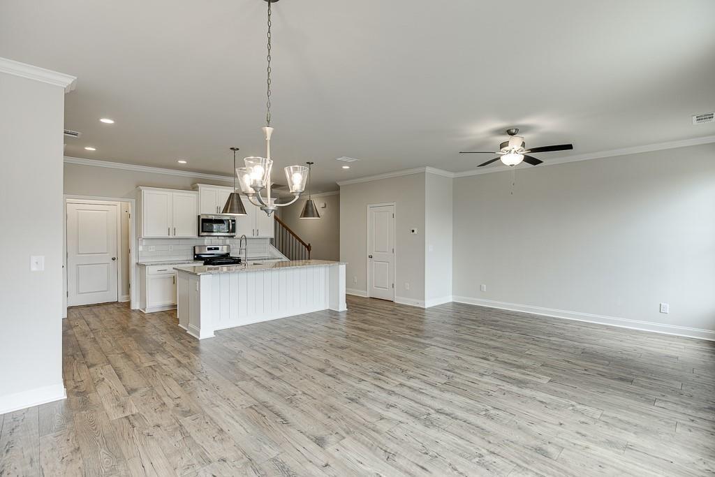 761 Woods Chapel Road Sugar Hill, GA 30518 - Photo 12 of 67 a view of kitchen with refrigerator and ceiling fan